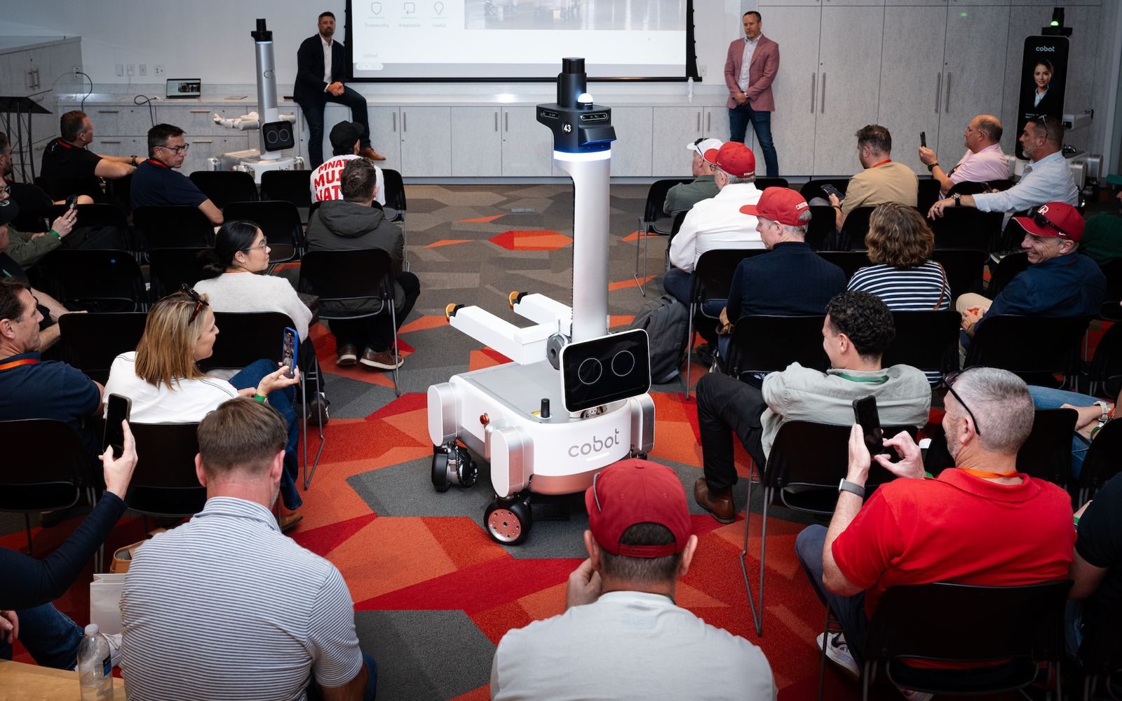 Executives interacting with a mobile service robot during a Silicon Valley immersion