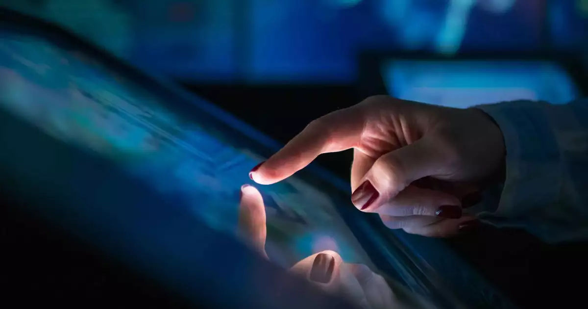 Hand touching a glowing digital screen representing AI-driven HR transformation
